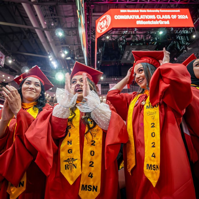 Master of Science in Nursing degree recipients clapping