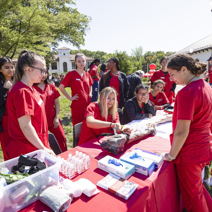 Nursing students at table on campus