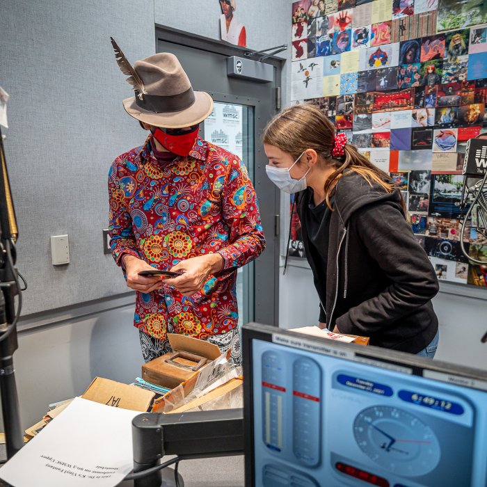 Dr. Kopell “Dr. K” with his daughter Elsa, aka for radio purposes “Princess Funk,” look through records in the studio at WMSC radio.