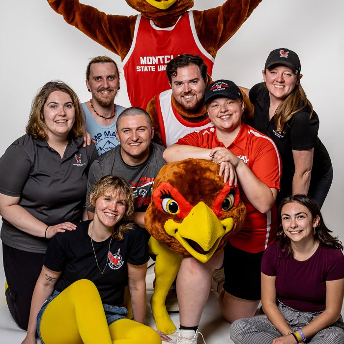 People who portrayed the old and new Rockys pose for a group photo.