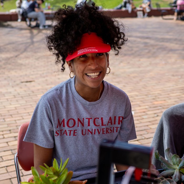Garden Manager, Brittney Portes, seated at a table at Earth Day 2026.