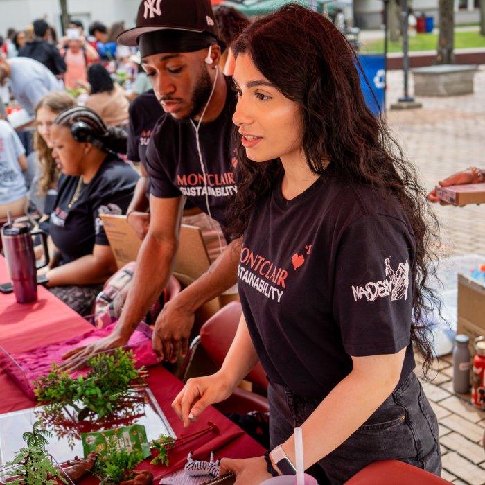 Two interns running a table activity at Earth Day 2026.