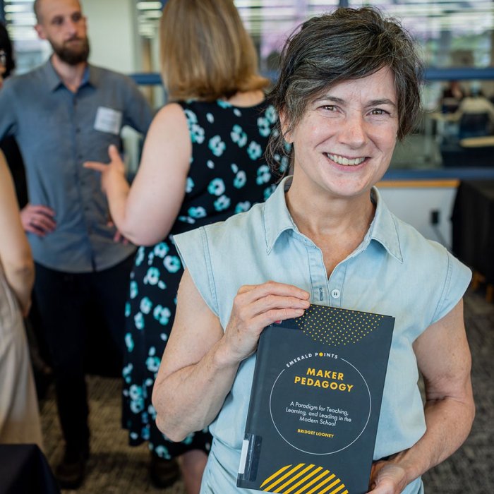 author holding book