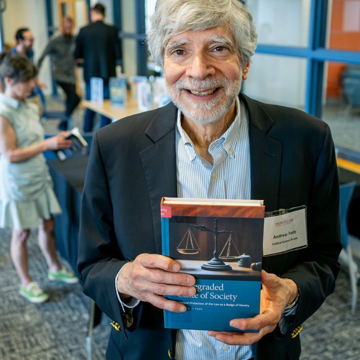 author holding book