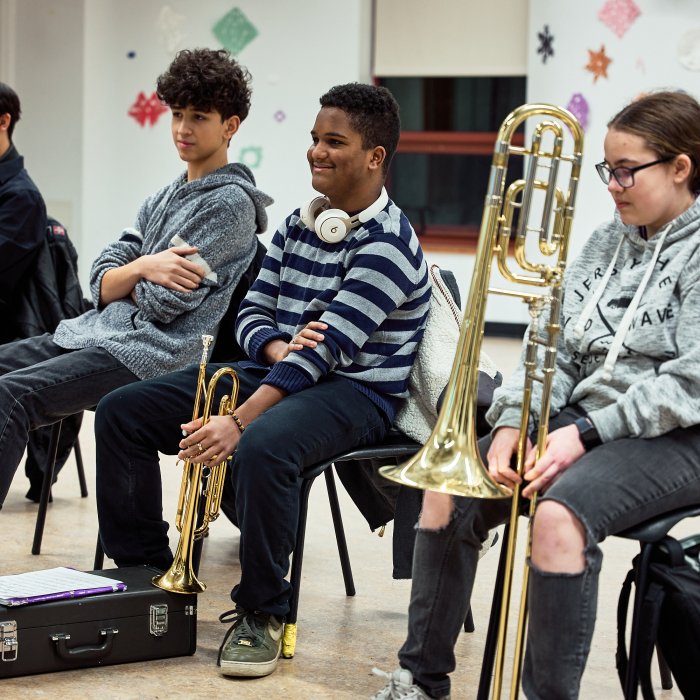Cali Pathways Students smiling and receiving new instruments