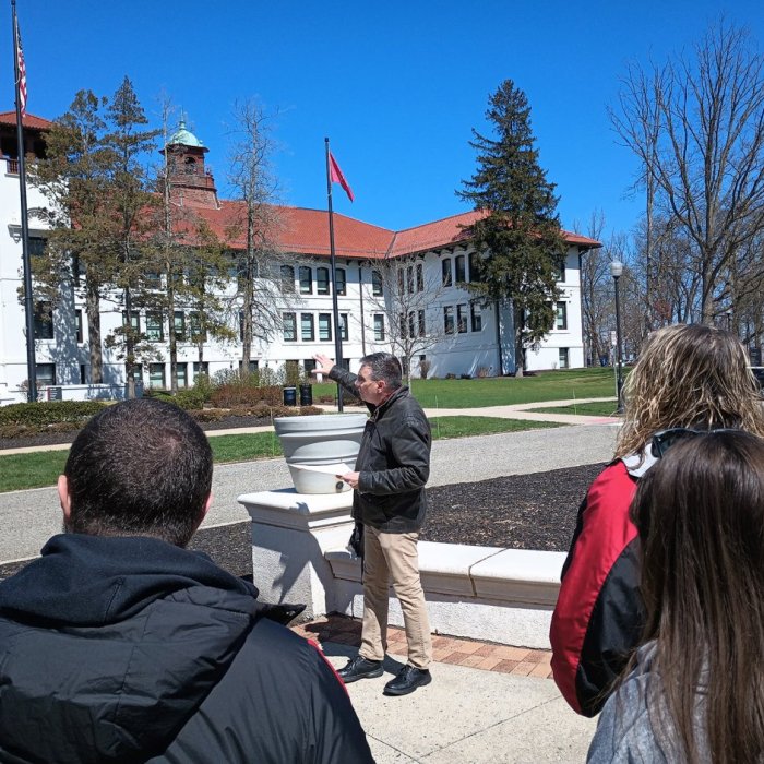 archivist paul martinez pointing to cole hall