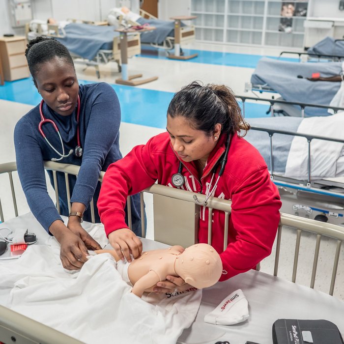 Nursing students demonstrating a pediatric simulation.