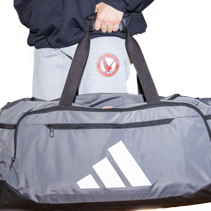 photo of a duffle back and sweatpants available for purchase at the rec store