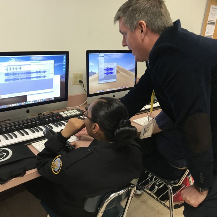 Music Education student at computer with professor