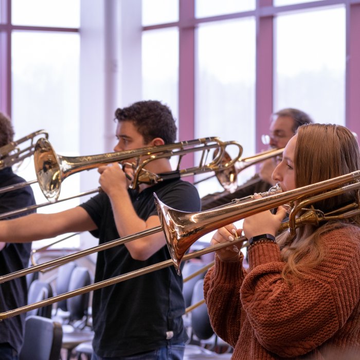Brass students rehearsing trombones