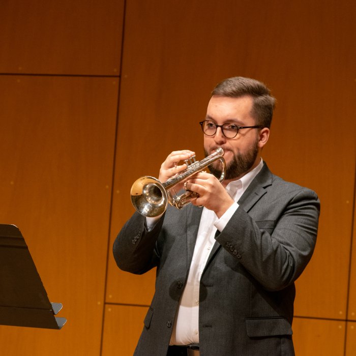 Trumpet student performing on stage