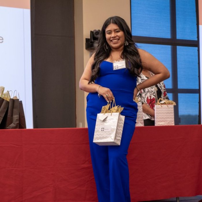 Valerie Chica, a Cohort 3 graduate, celebrates her success with peers.