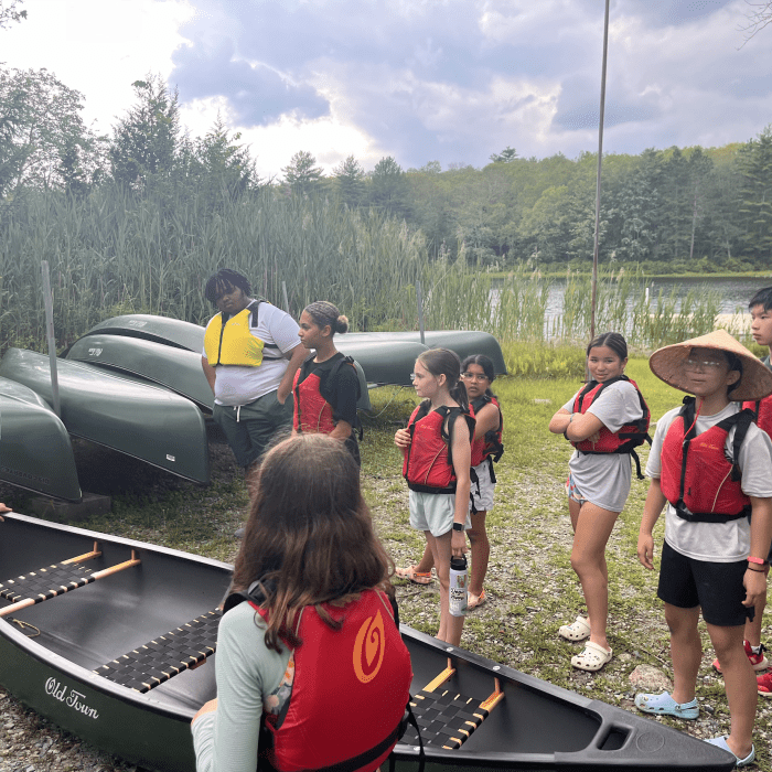 Stokes campers launching canoes