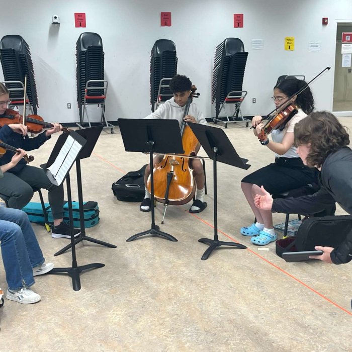 Cali Summer Strings youth quartet being coached by instructor