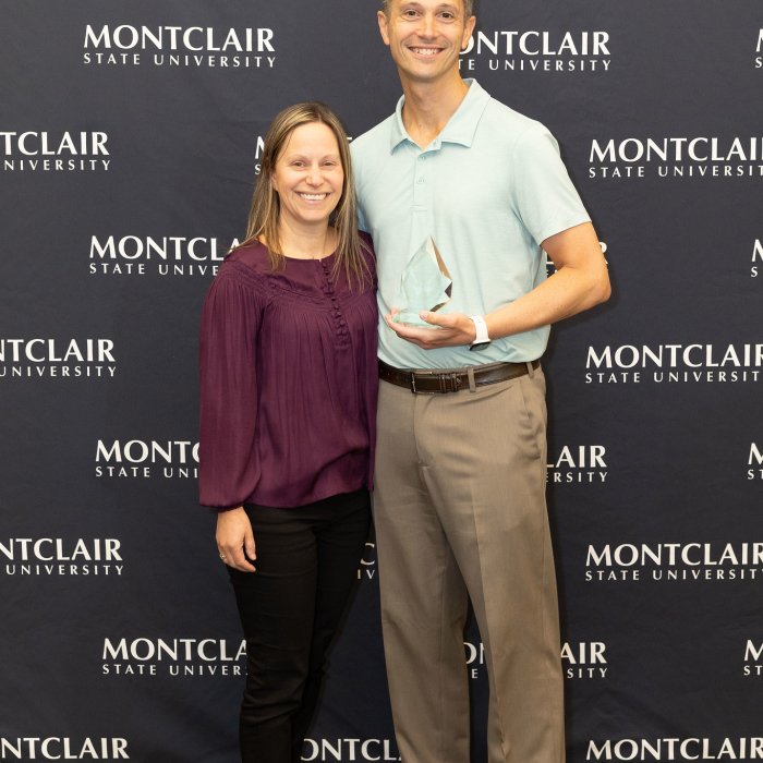 Professor Ben Fairclough poses with his award and a colleague at the Advising Excellence Awards 2026.