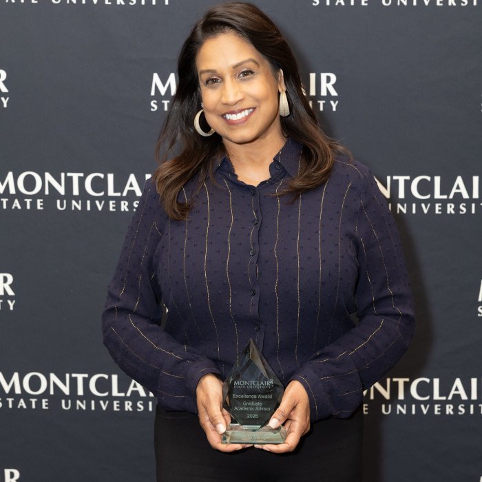 Dr. Samita Mezger poses with her award at the Advising Excellence Awards 2026.