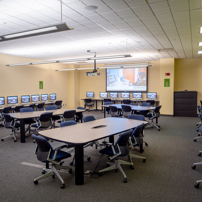 Computer lab with computers lining the walls 