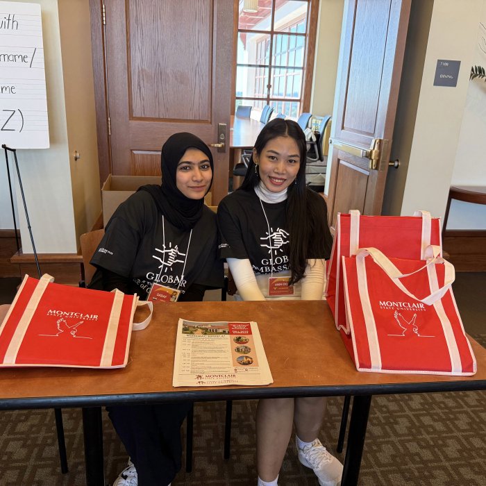Two global ambassadors sitting at a table at international student orientation
