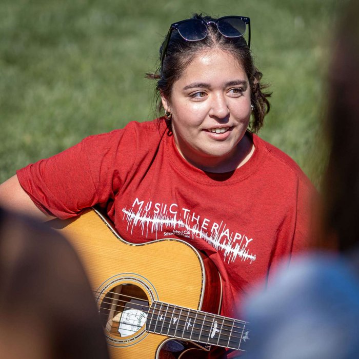 Music Therapy student with guitar