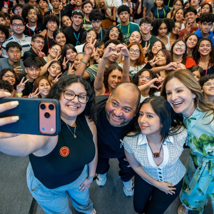 Dozens of smiling students snap a group selfie during HSCI Day at Montclair State University.
