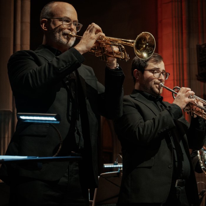 Cali Brass Professors including Dr. Micah Killion, left, performing on stage at Trinity Church NYC