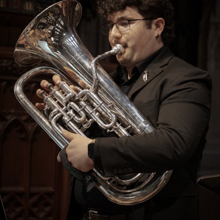 CaliBrass Ensemble on stage at the Music 250 concert at Trinity Church NYC, conducted by Dr. Thomas McCauley and organized by Dr. Micah Killion.