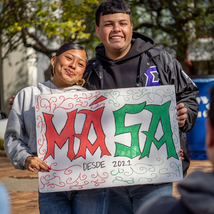 MASA Sign and Students at HHM Block Party