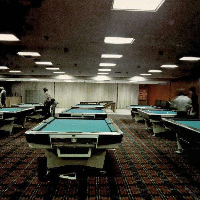 Student Center game room with several pool tables, 1979