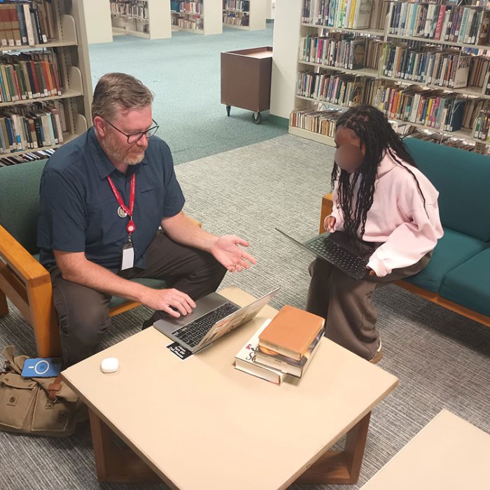 a student and teacher in discussion