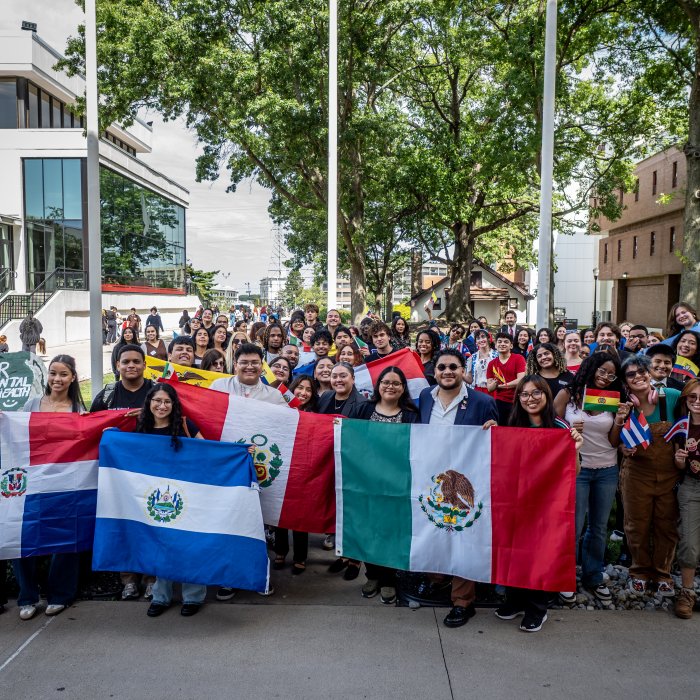 People Posing for a photo at the Hispanic Heritage Month Flag Raising