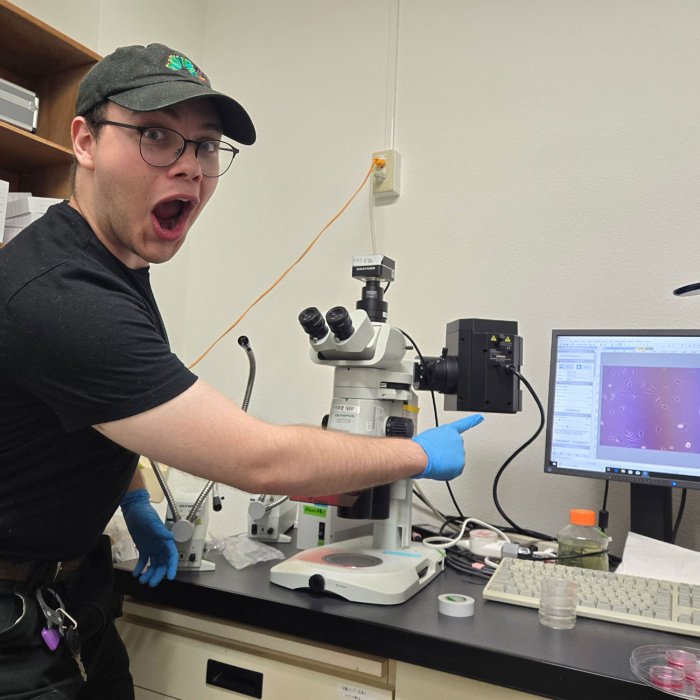 student excited about microscopy findings