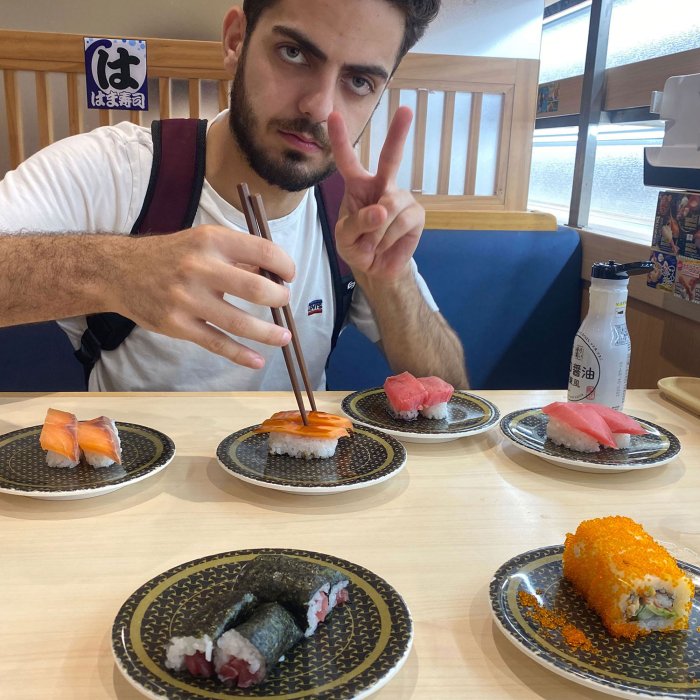 student eating sushi