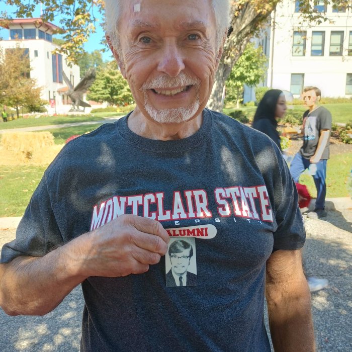an alumni with his yearbook photo
