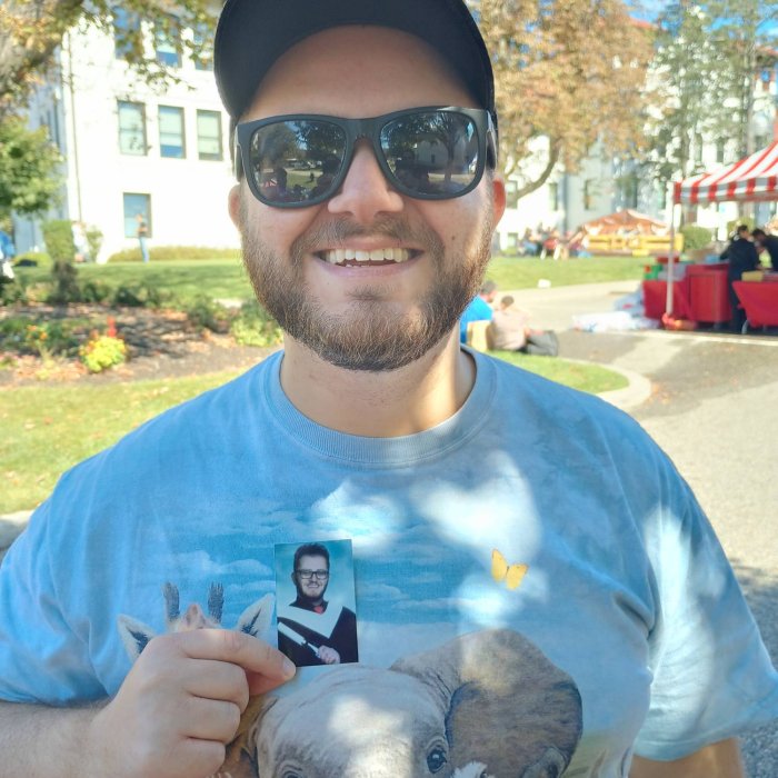 an alumni with his yearbook photo