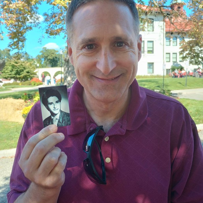 an alumni with his yearbook photo