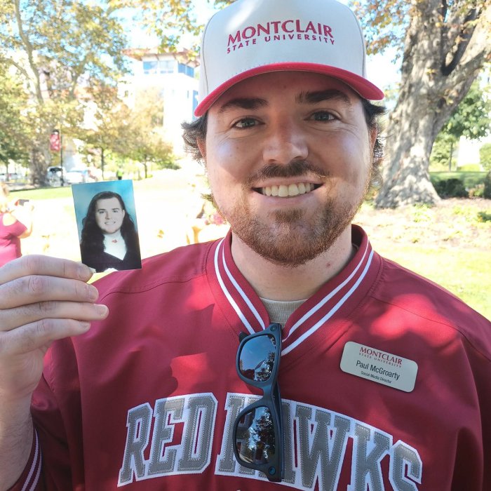 an alumni with his yearbook photo
