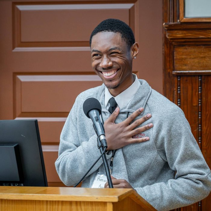 grad student smiling at podium