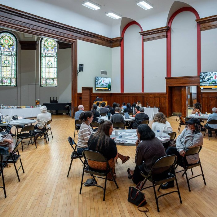 attendees seated a multiple tables