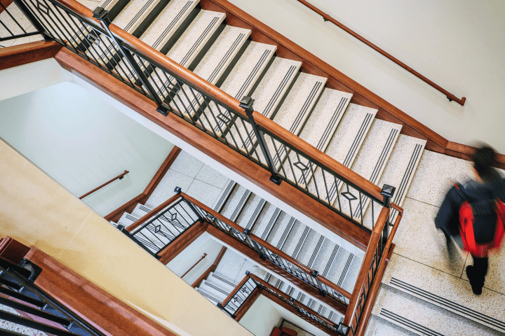 Student walking up stairs