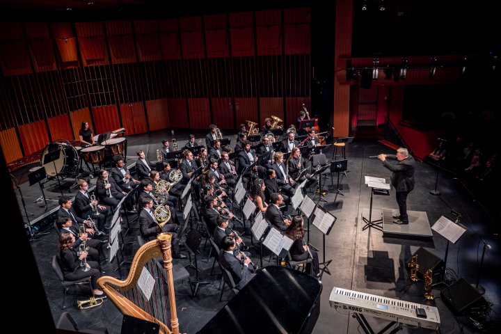 University Wind Symphony on stage performing