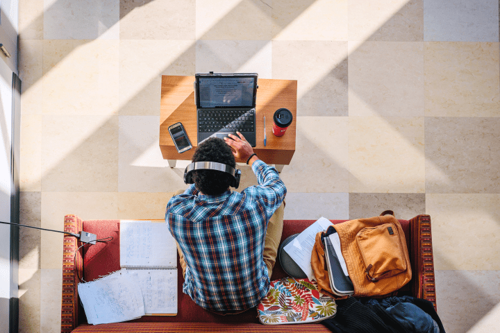 Student studies on their laptop.