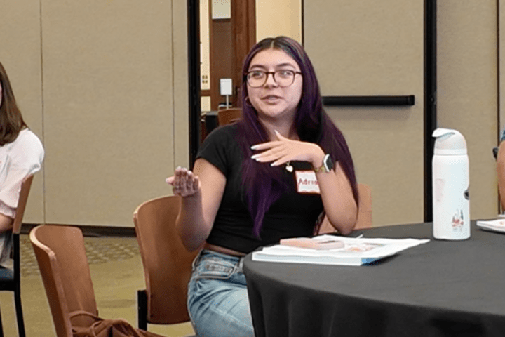a student speaks at the summer induction retreat