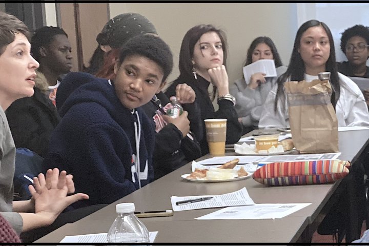 Students sitting at a table having a discussion