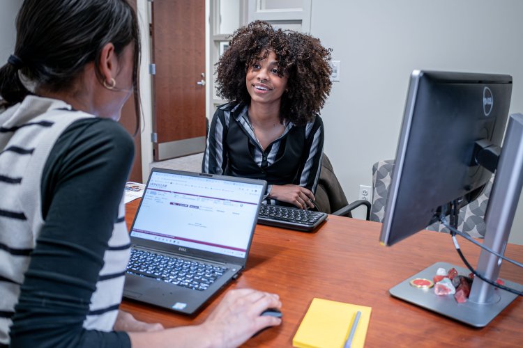Student meeting with academic advisor