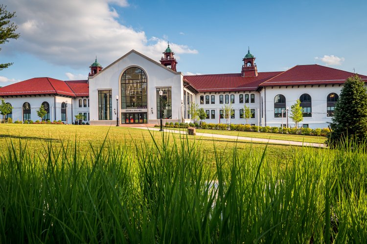 A picture of Cole Hall with grass in the foreground and sky in the background.