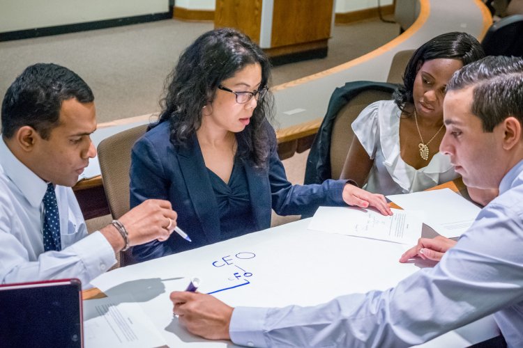 Four students working on a project in class