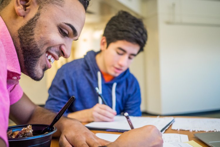 two students studying at a table