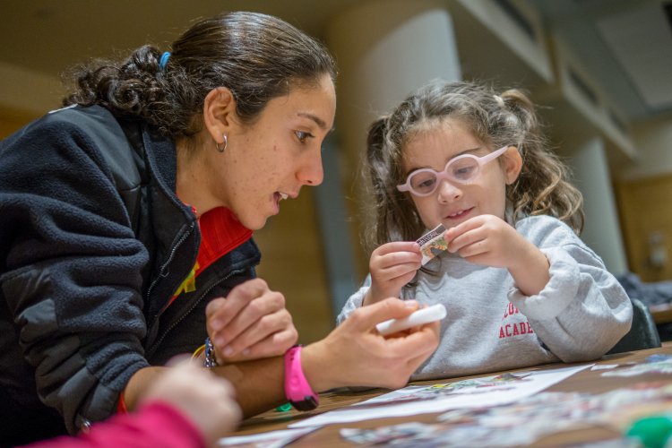 Teacher helping a child 