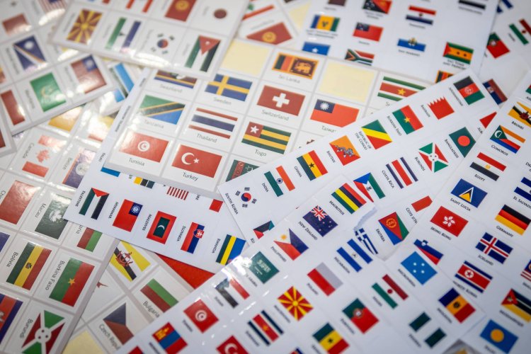 A pile of stickers of various country flags