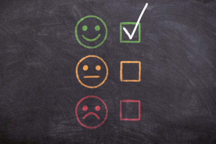 a checkmark next to a smiling image